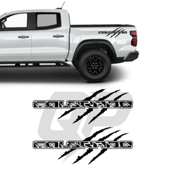 White truck with 'Colorado' decals on a white background