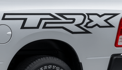 TRX decal on a vehicle's side, with Firestone branding visible on the tire.
