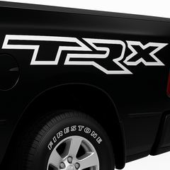 Black truck with 'TRX' decal on the side