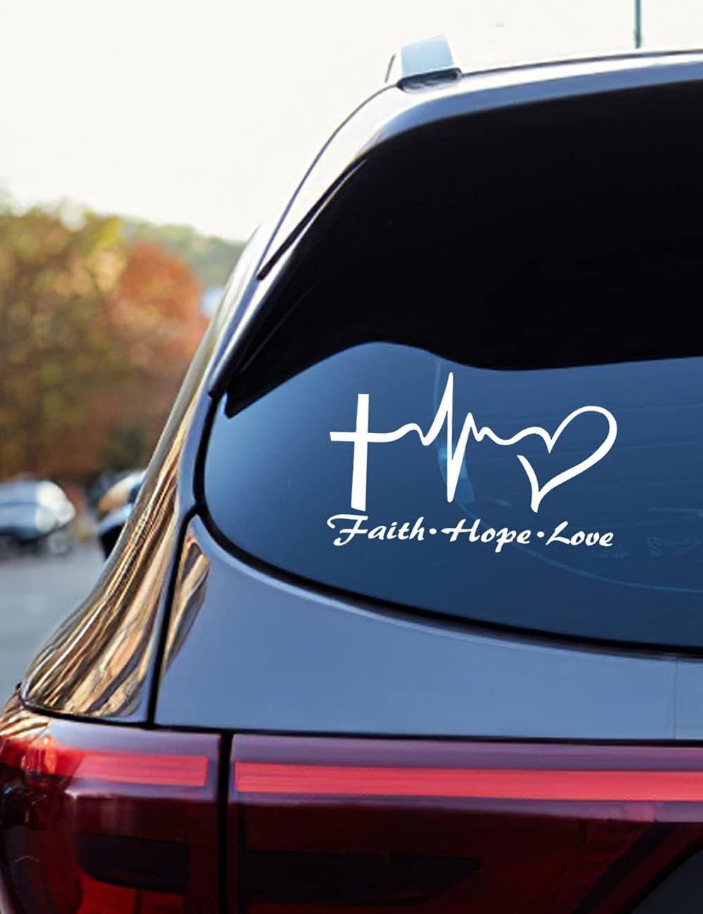 A white vinyl decal sticker with a cross and the text 'FAITH HOPE LOVE JESUS CHRIST' designed for car or truck windows.