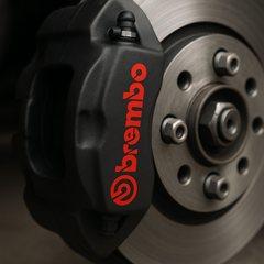 Brembo brake caliper on a car wheel with a dark background