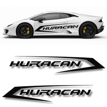 Cargar imagen en el visor de la galería, White sports car with 'Huracan' branding and three 'Huracan' logo designs below.