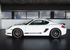 White Porsche sports car in a showroom setting