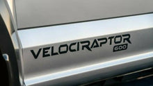 Load image into Gallery viewer, Close-up of a 'Velociraptor 600' decal on a vehicle's side panel.