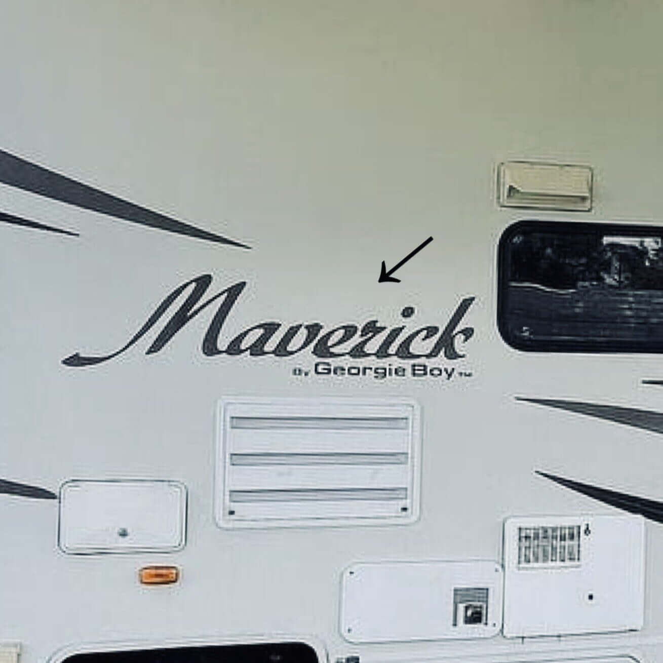 White RV with 'Maverick by Georgie Boy' decal on a white background