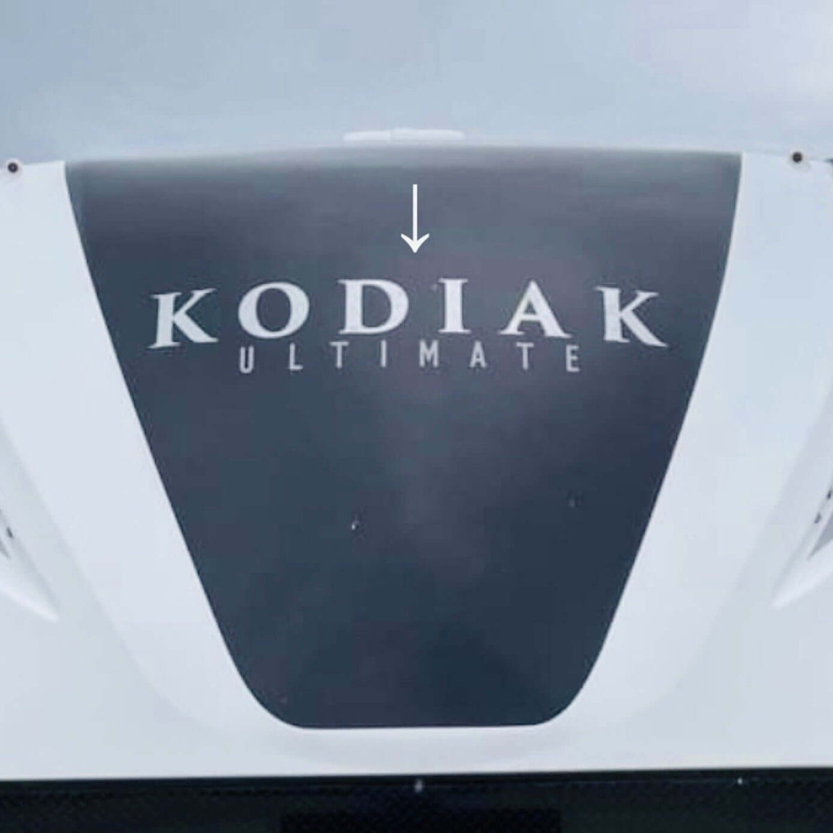 Kodiak Ultimate decal on a vehicle roof with a clear sky background